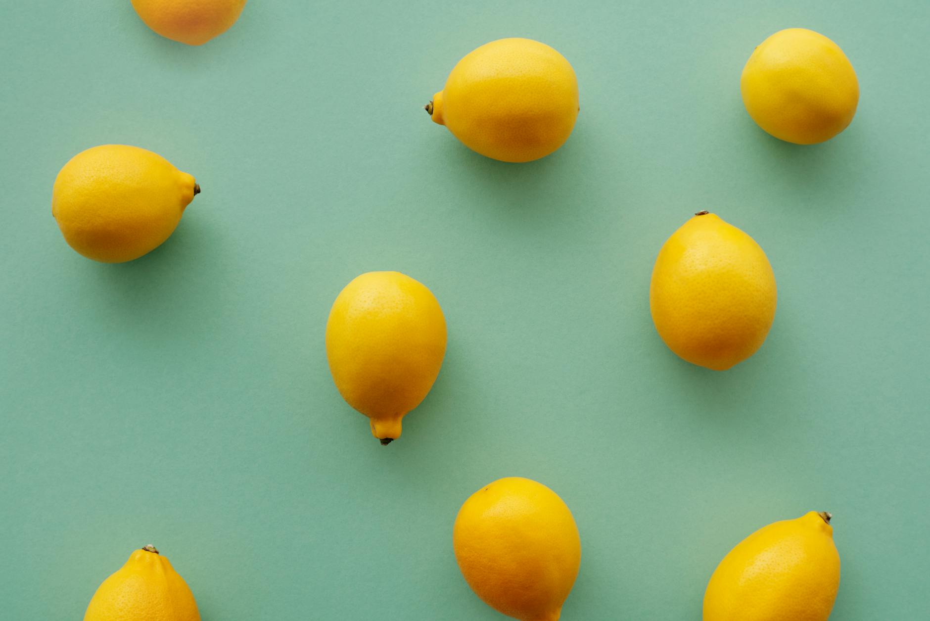 Colorful lemon vibrators and adult toys displayed on a bright yellow background, showcasing modern intimacy tools